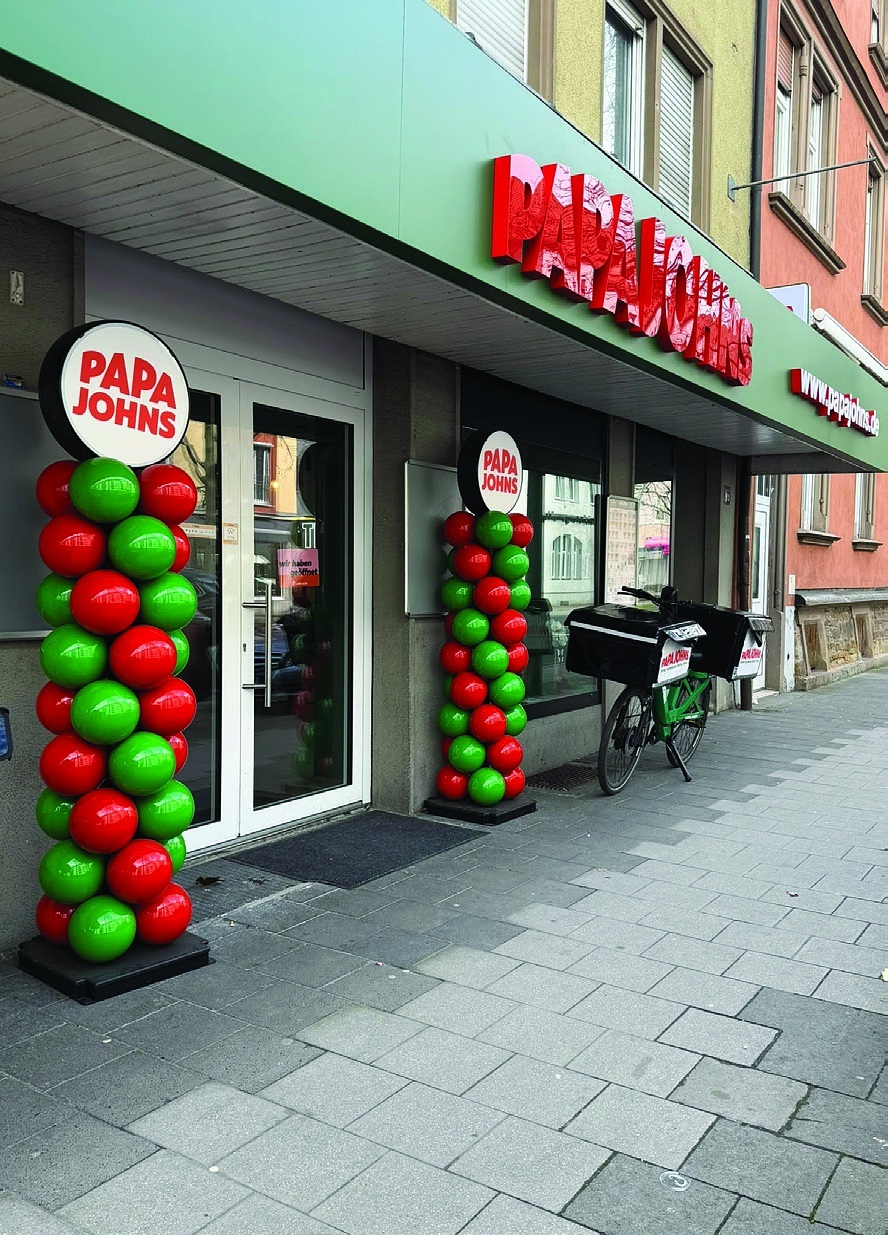 Papa Johns Store Eingang mit Lieferfahrrad